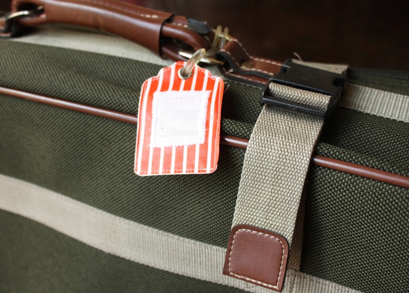 orange-striped-luggage-tag-on-suitcase.jpg